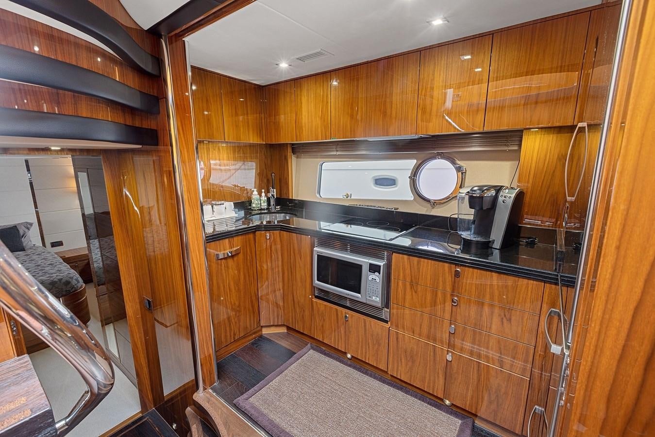 a kitchen with wooden cabinets aboard DIGGIN Yacht for Sale