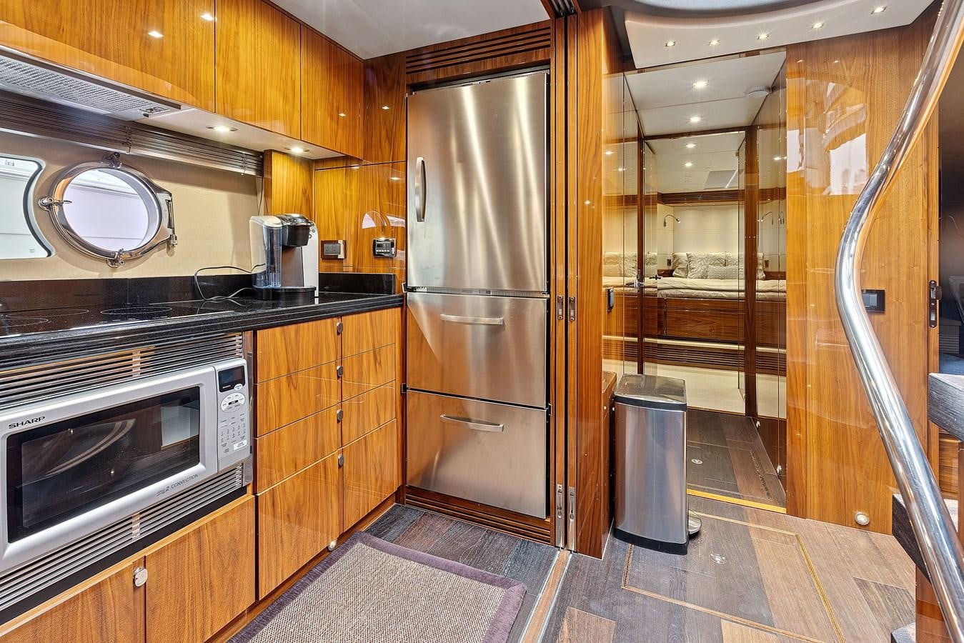 a kitchen with wooden cabinets aboard DIGGIN Yacht for Sale