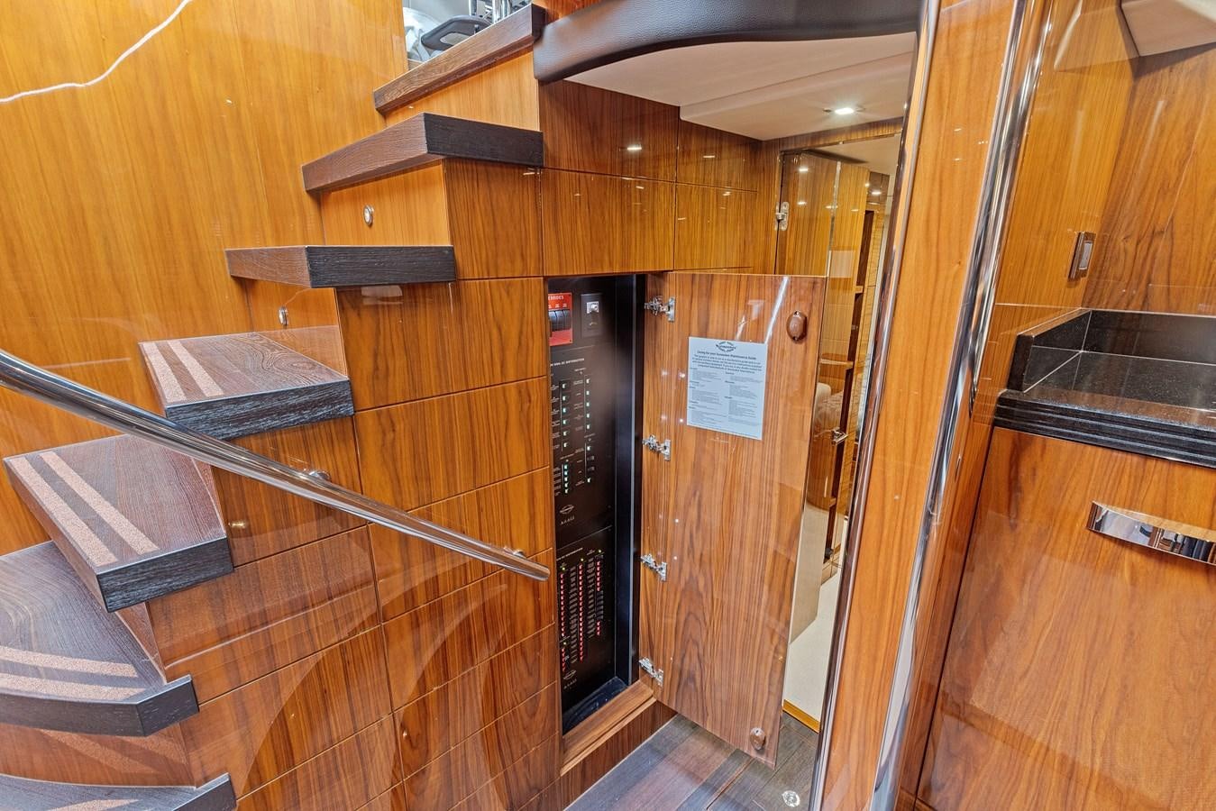 a kitchen with wooden cabinets aboard DIGGIN Yacht for Sale