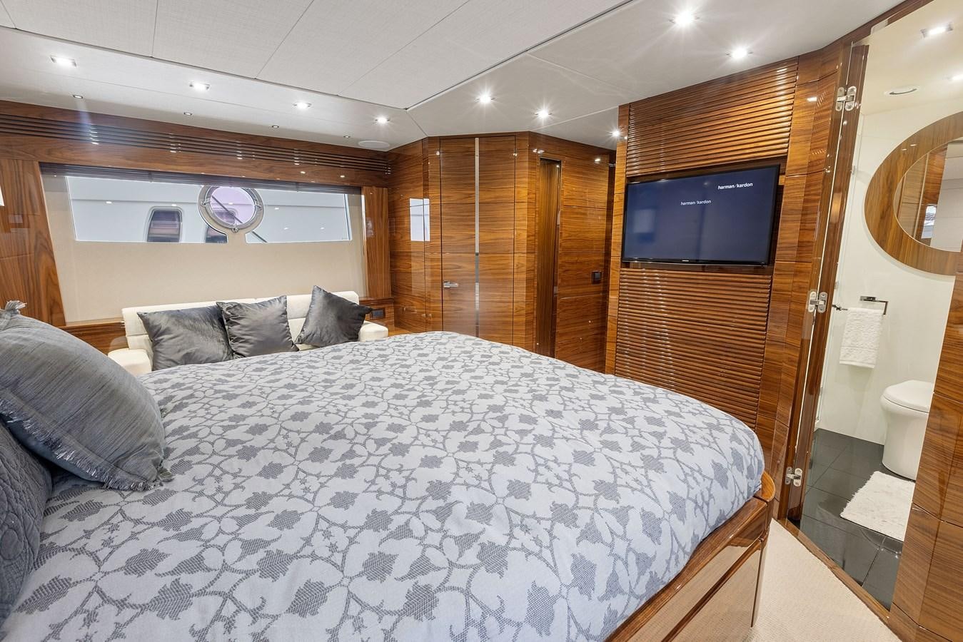 a bed with a white sheet aboard DIGGIN Yacht for Sale