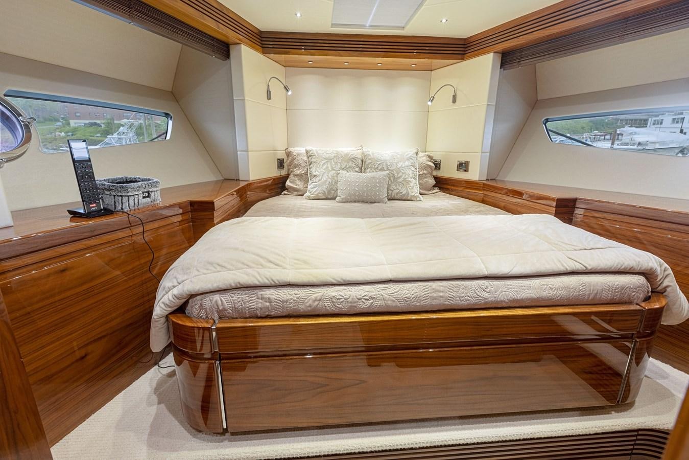 a bed with a laptop on it aboard DIGGIN Yacht for Sale