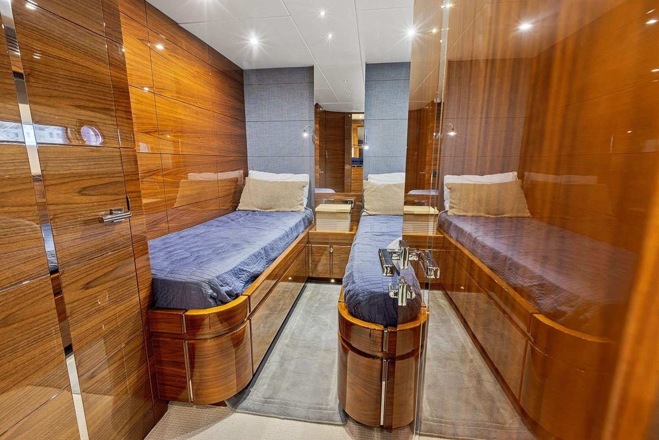 a room with a bed and a bench aboard DIGGIN Yacht for Sale