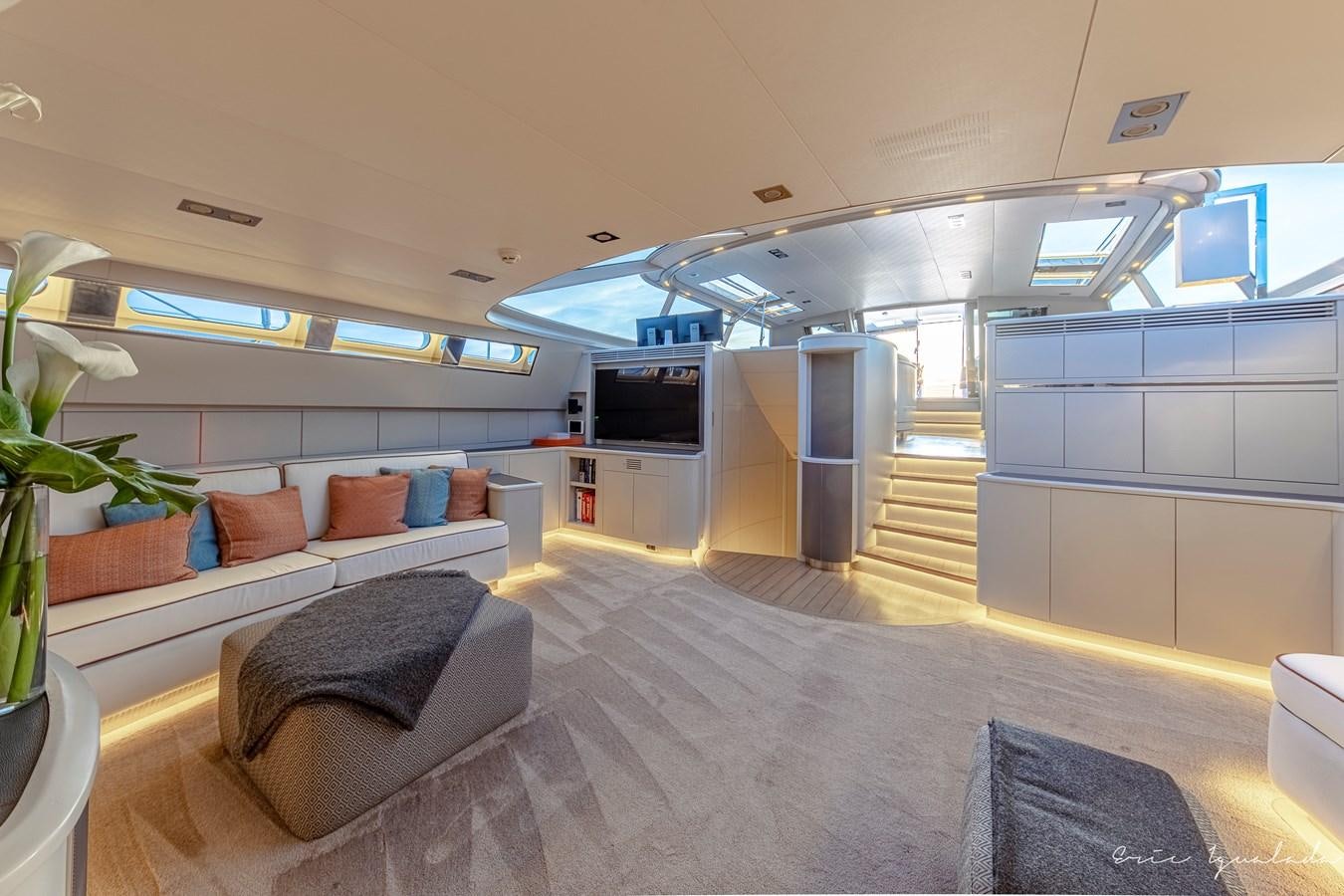 a room with a couch and a television aboard MY STAR Yacht for Sale