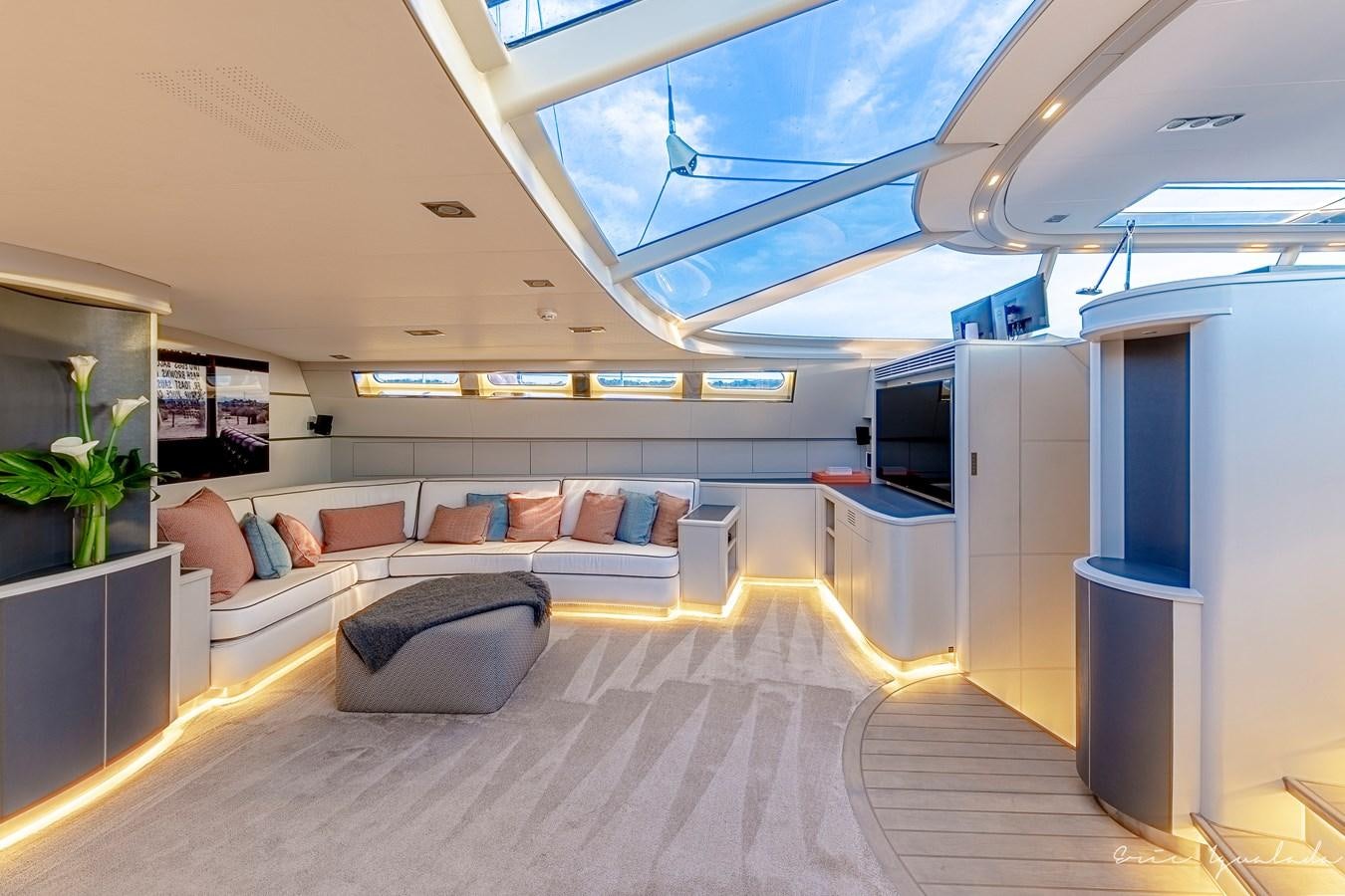 a large room with a couch and a tv aboard MY STAR Yacht for Sale