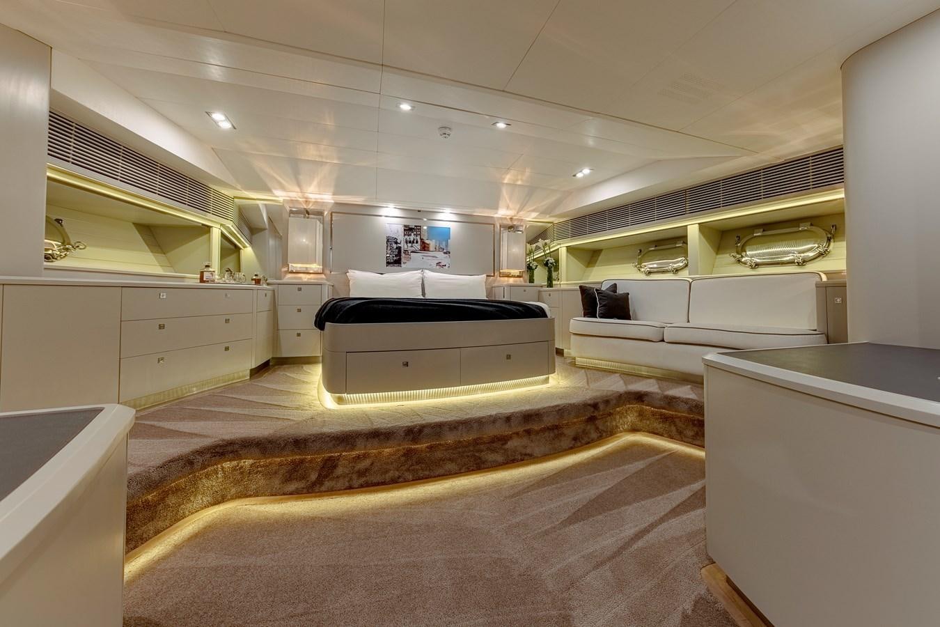 a large room with a large bed aboard MY STAR Yacht for Sale