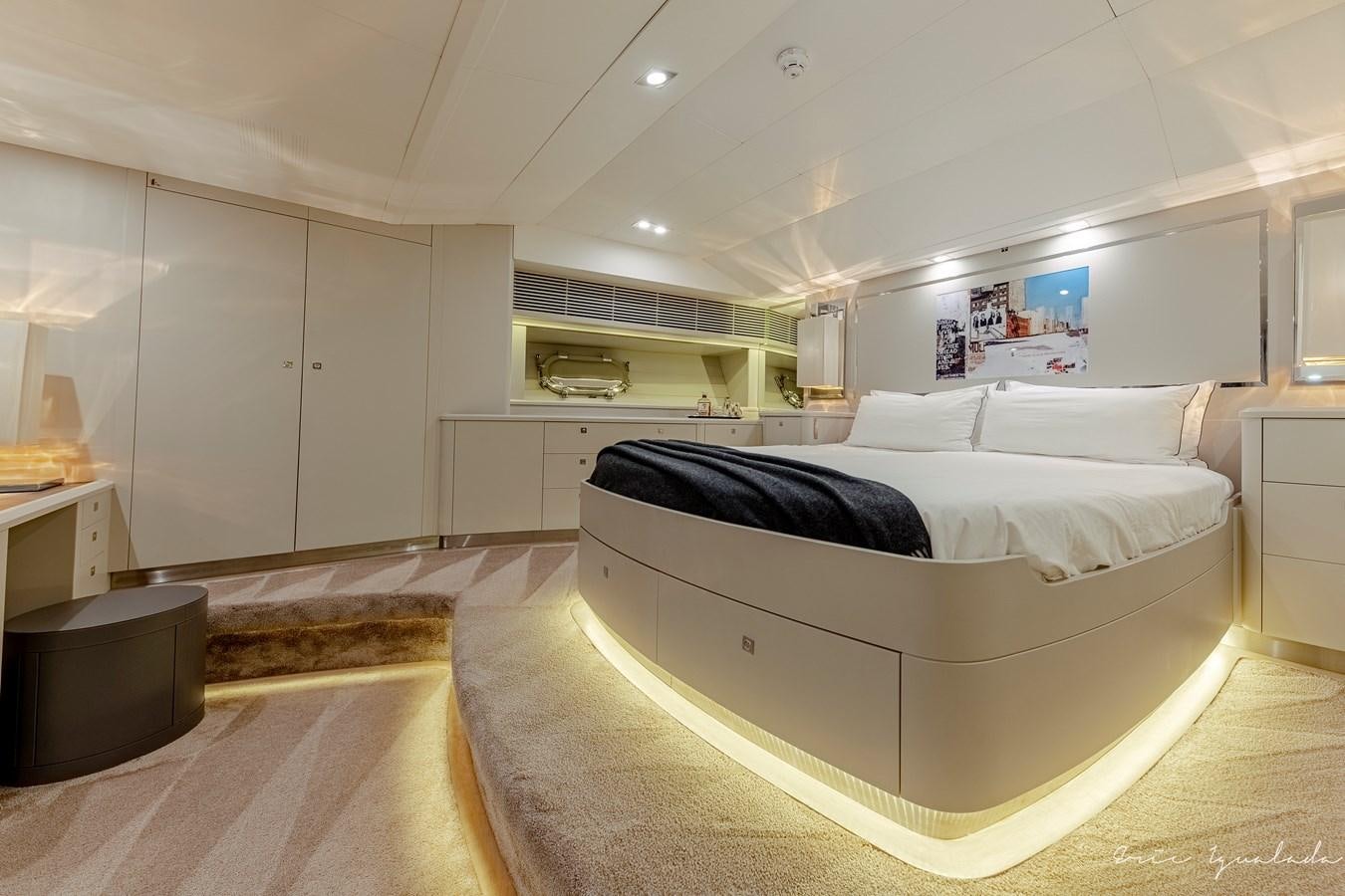 a bedroom with a bed aboard MY STAR Yacht for Sale