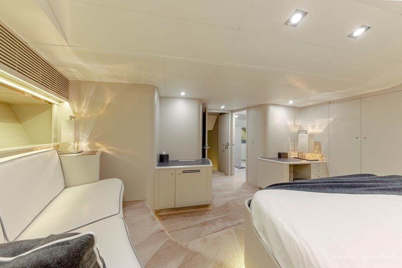 a room with a bed and a desk aboard MY STAR Yacht for Sale