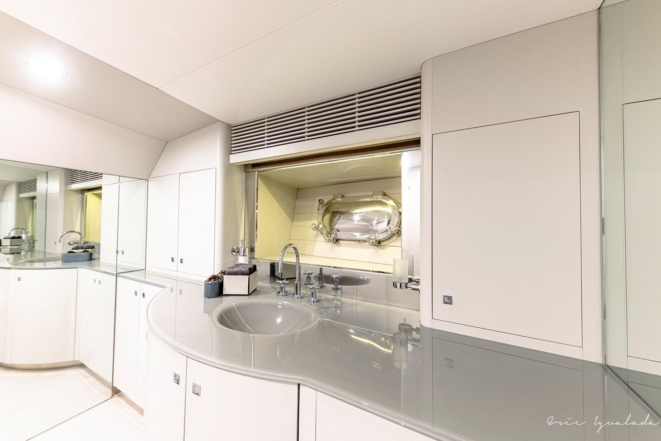 a bathroom with a sink and a mirror aboard MY STAR Yacht for Sale