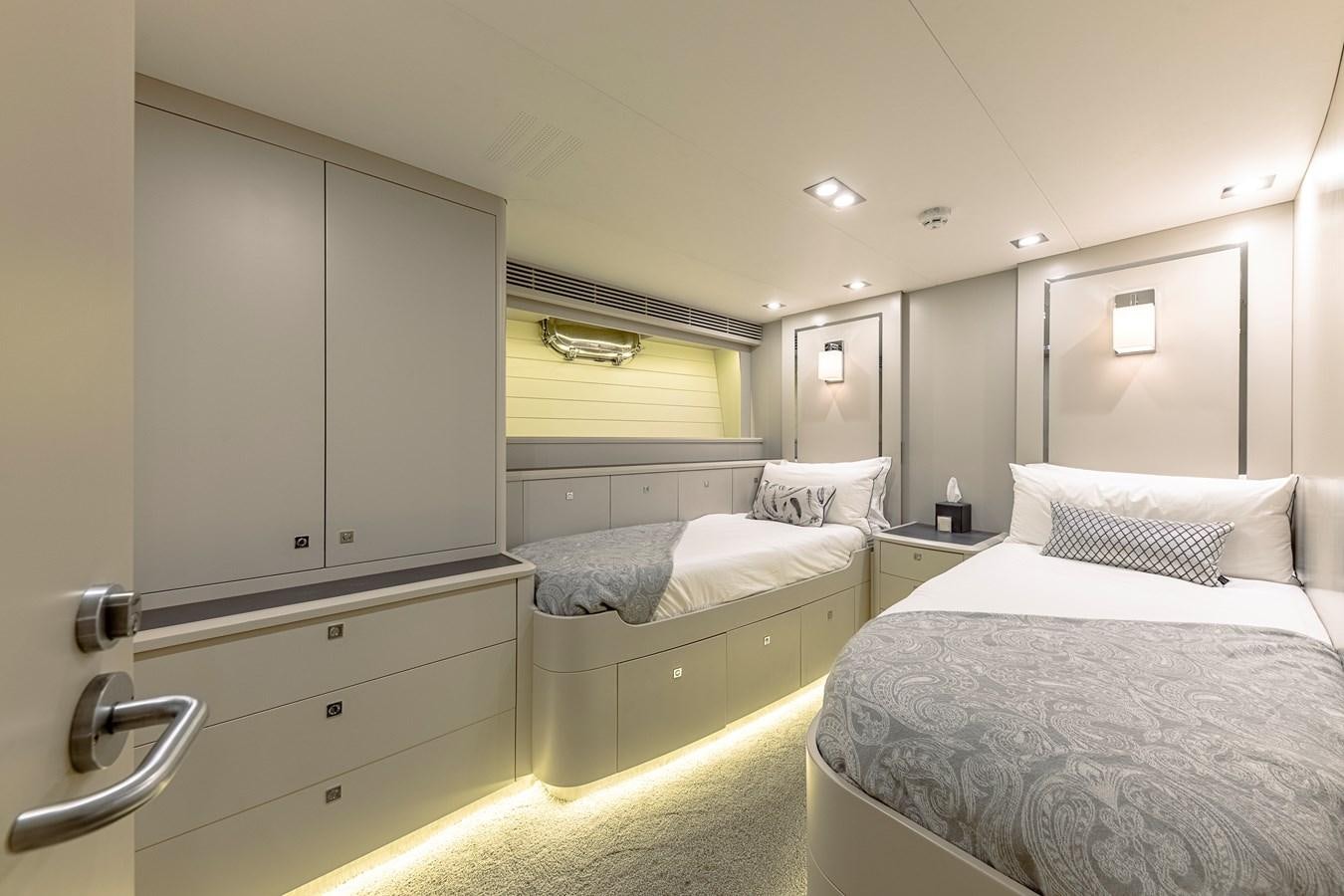a room with a couple of beds aboard MY STAR Yacht for Sale