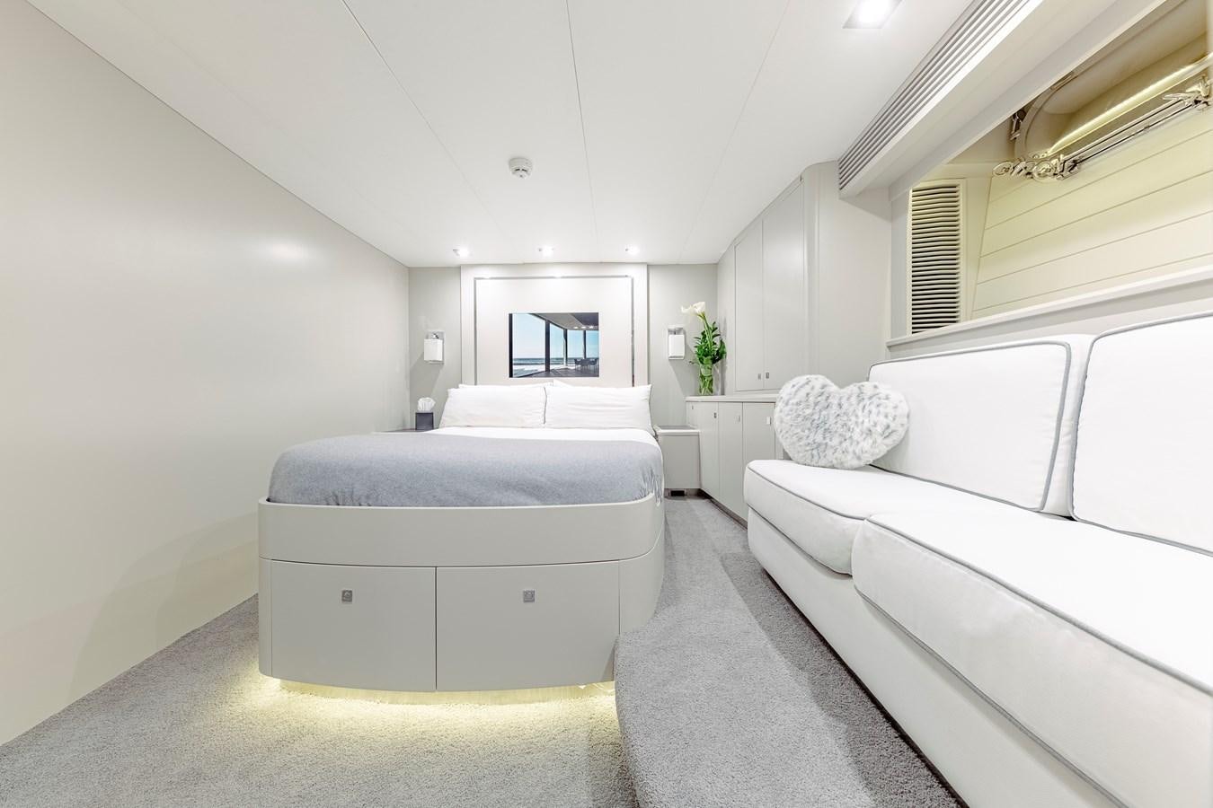 a room with white couches aboard MY STAR Yacht for Sale