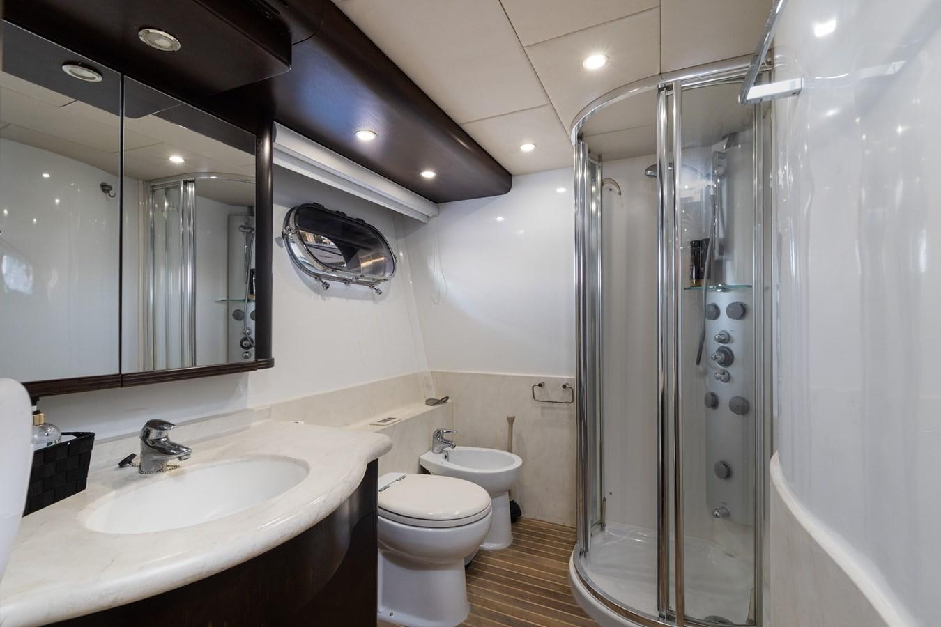 a bathroom with a glass shower aboard NIRVANA Yacht for Sale