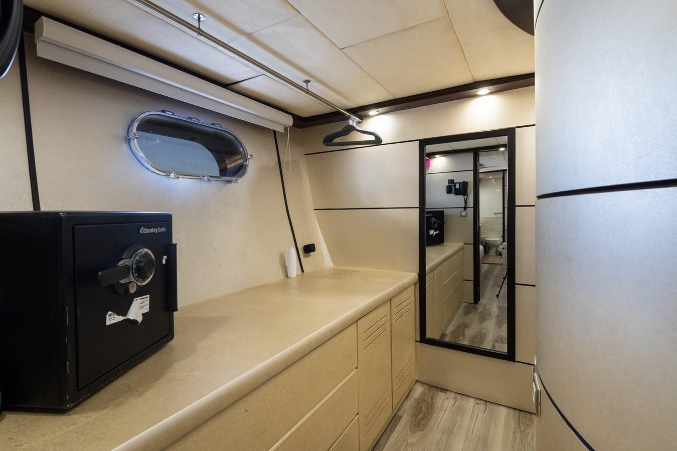 a room with a large mirror and a counter with a sink and a mirror aboard NIRVANA Yacht for Sale