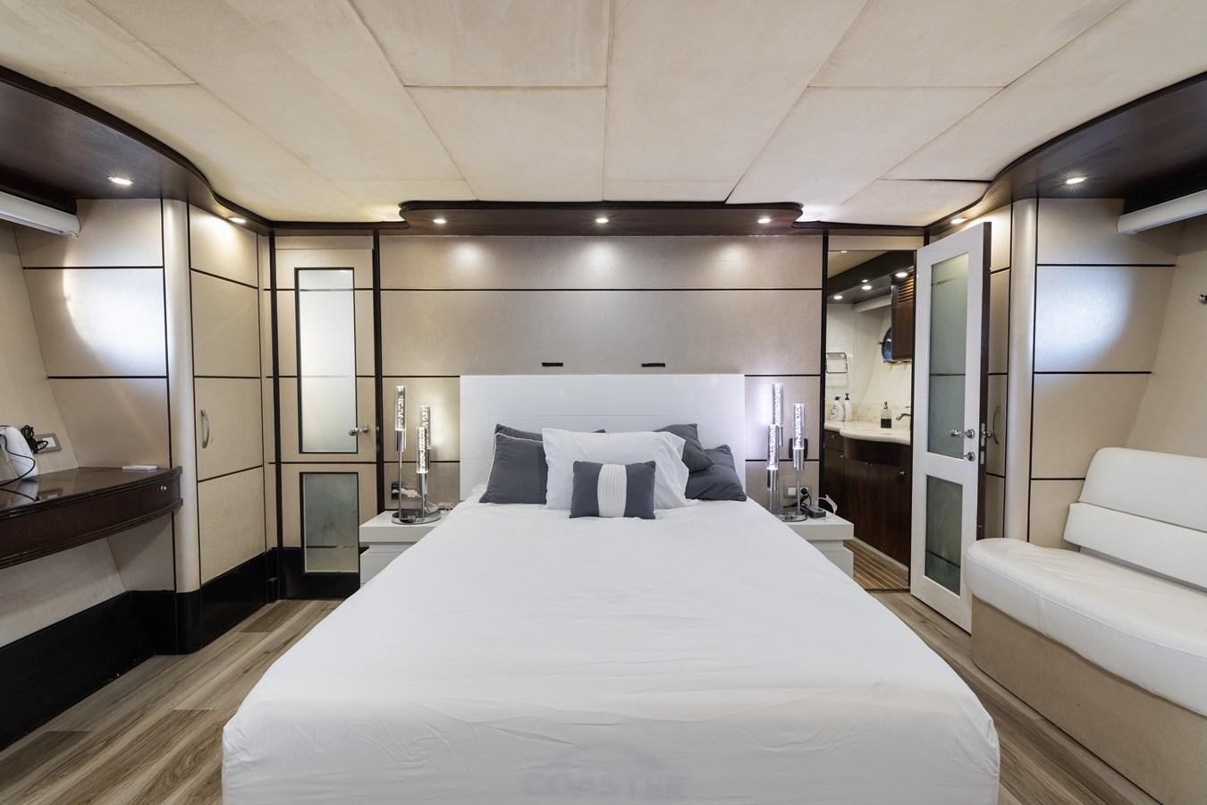 a large bedroom with a bed aboard NIRVANA Yacht for Sale