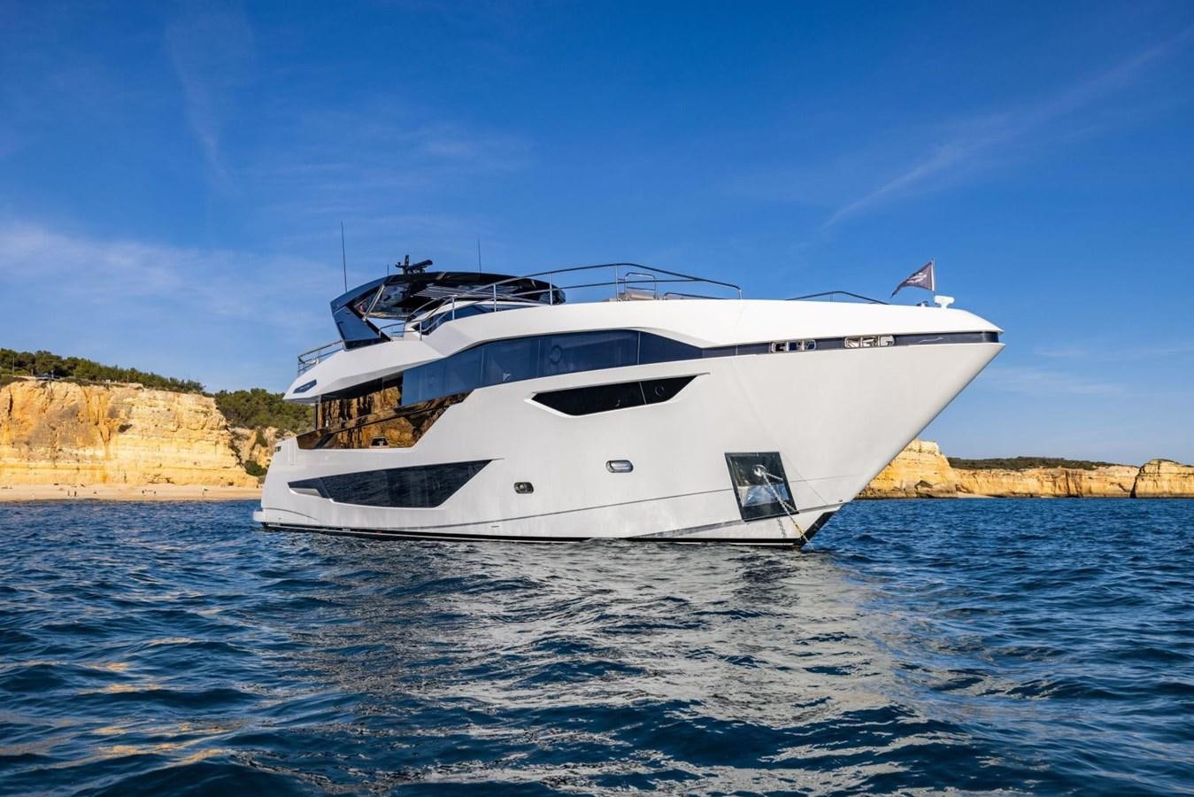 a white yacht on the water aboard SUNSEEKER 100 Yacht for Sale