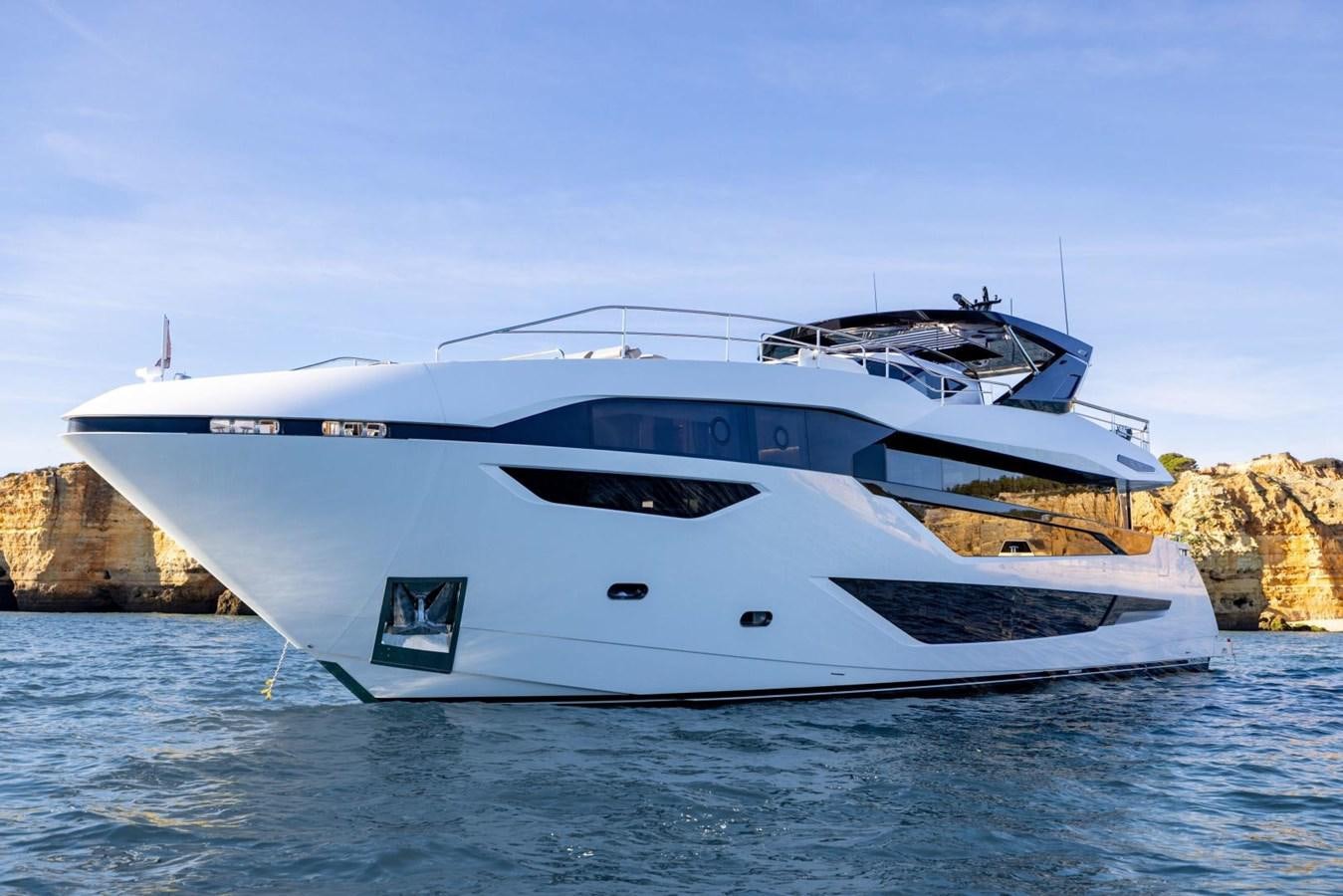 a white yacht on the water aboard SUNSEEKER 100 Yacht for Sale
