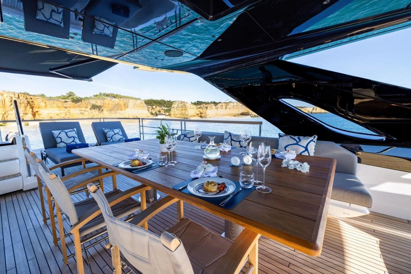 a table set for a meal aboard SUNSEEKER 100 Yacht for Sale