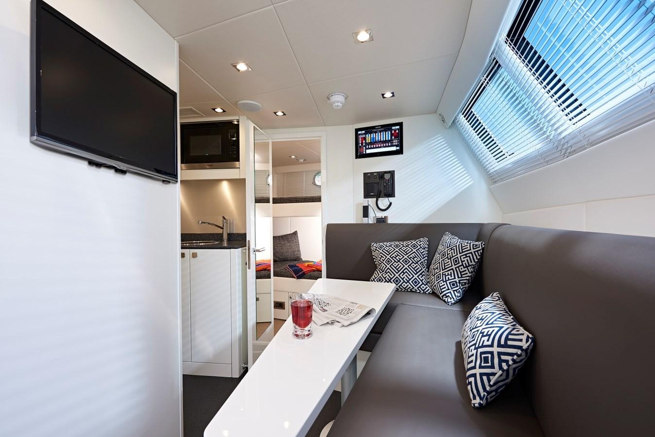 a living room with a couch and a tv aboard 95 YACHT Yacht for Sale