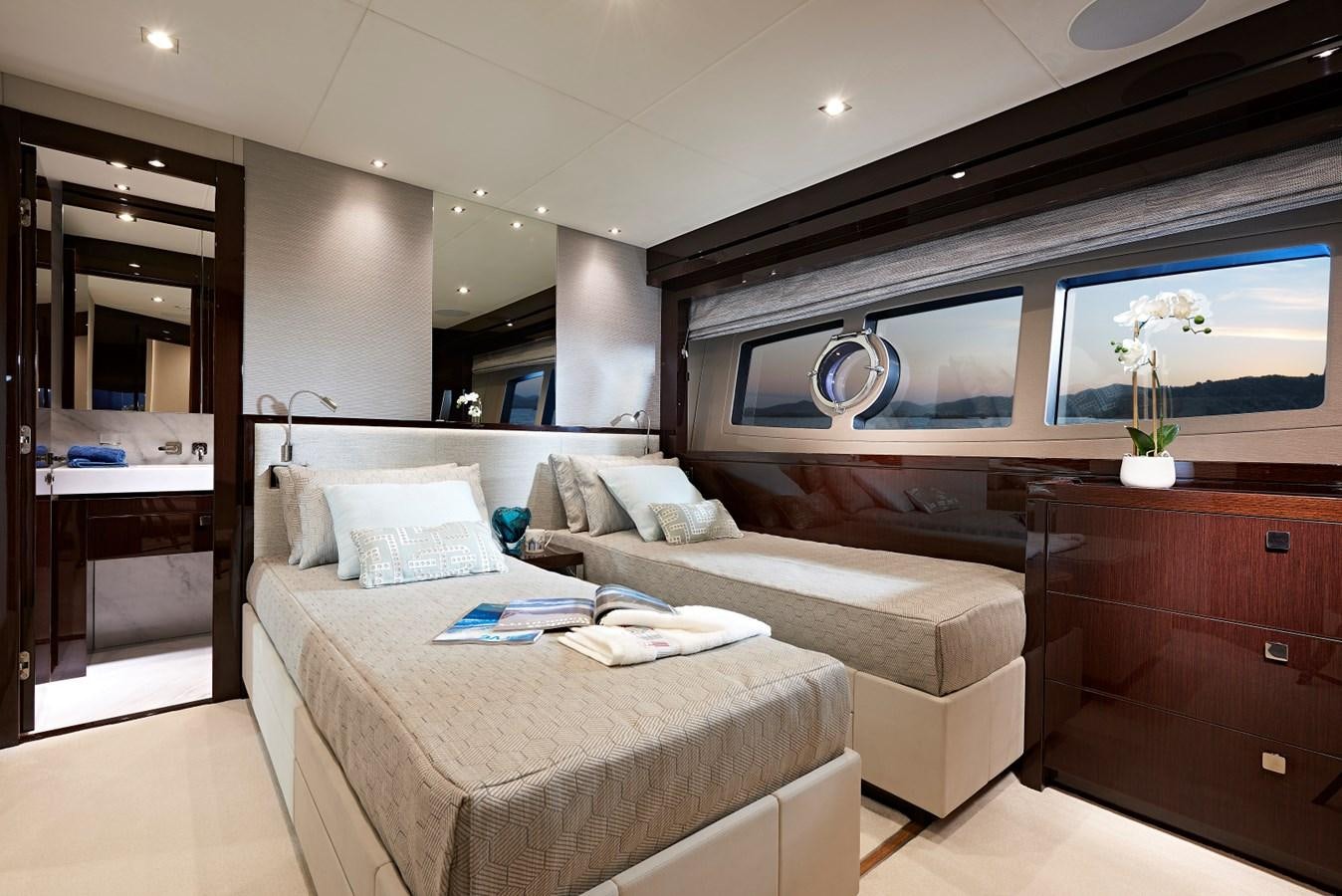 a room with a bed and a mirror aboard 95 YACHT Yacht for Sale