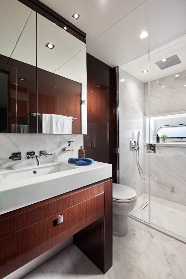 a bathroom with a sink toilet and a shower aboard 95 YACHT Yacht for Sale