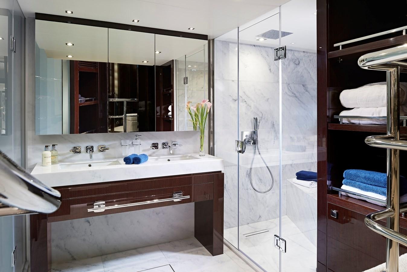 a bathroom with a glass shower aboard 95 YACHT Yacht for Sale