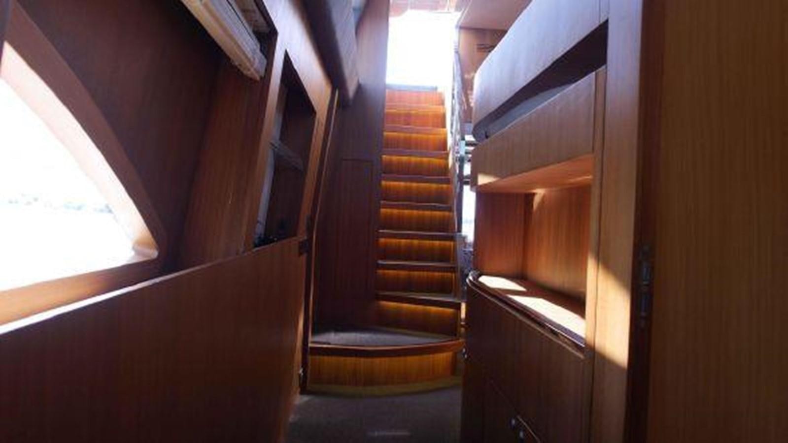 a staircase with wooden walls aboard PRIVILEGIO Yacht for Sale