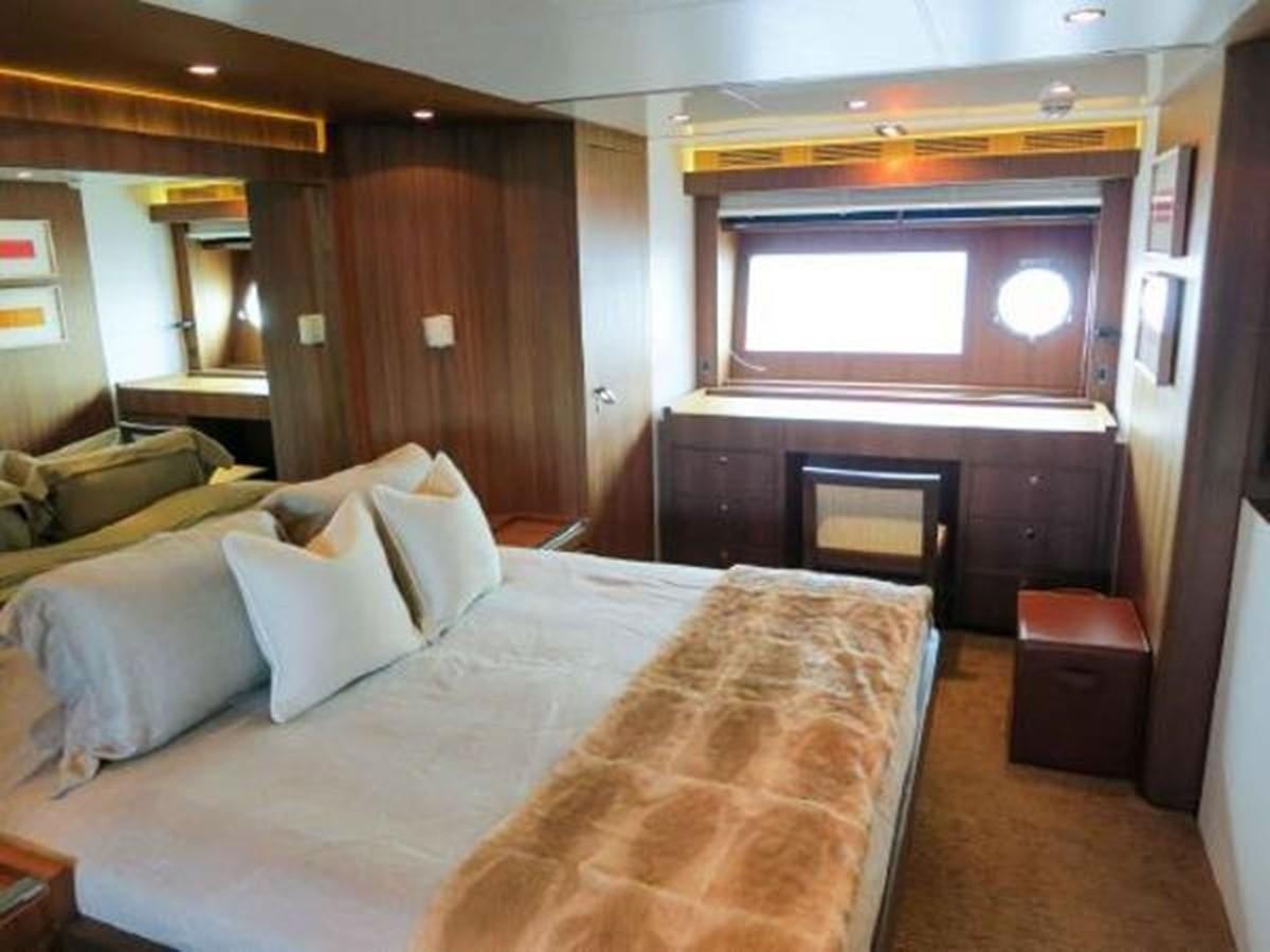 a bed in a room aboard PRIVILEGIO Yacht for Sale