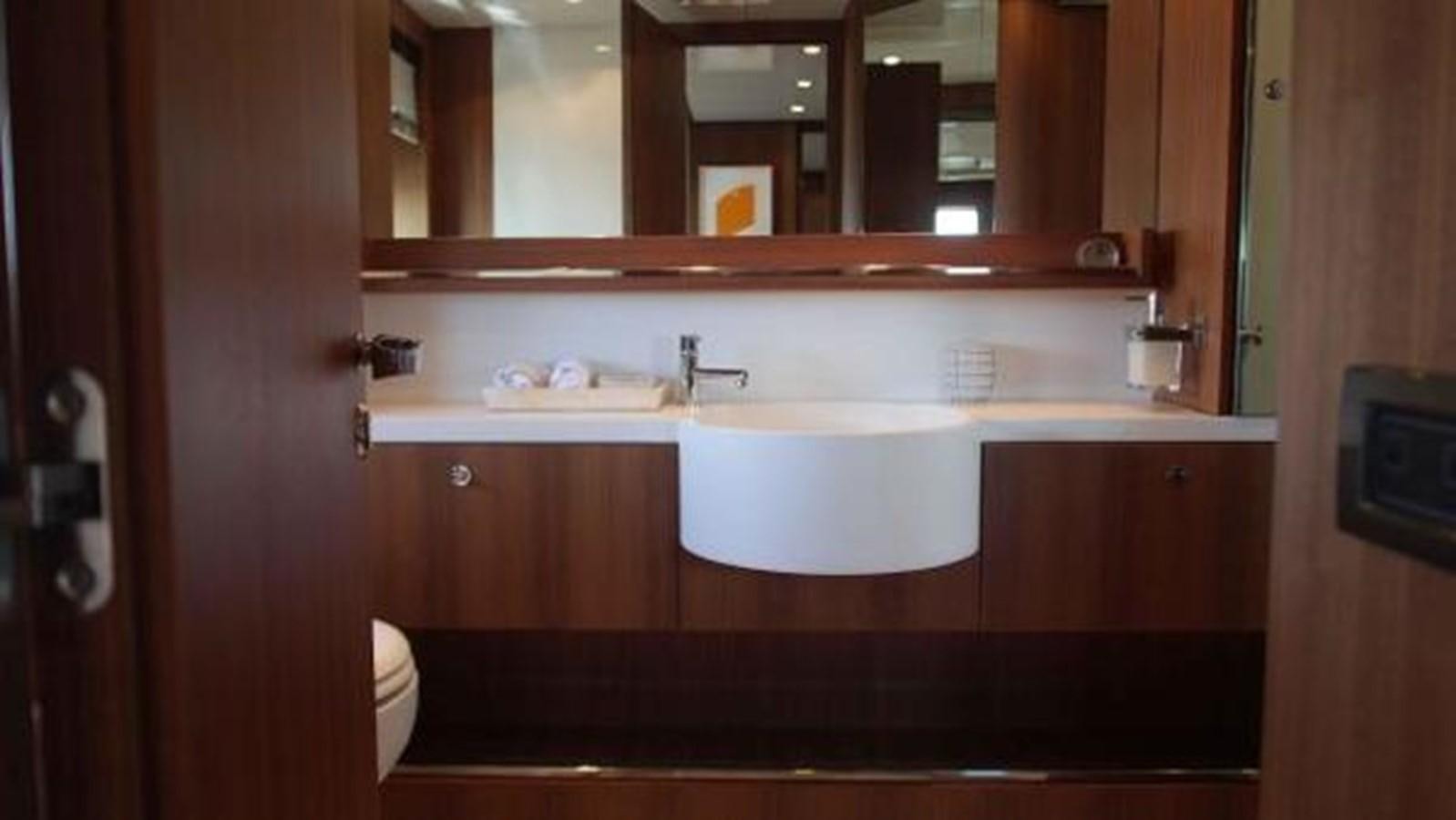 a bathroom with a sink and a mirror aboard PRIVILEGIO Yacht for Sale