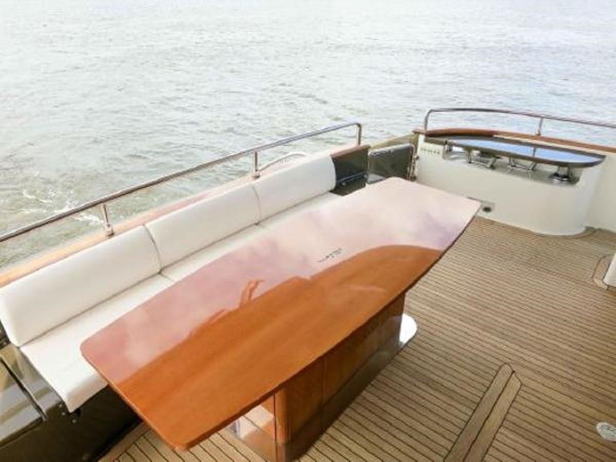 a pool with a table and chairs aboard PRIVILEGIO Yacht for Sale
