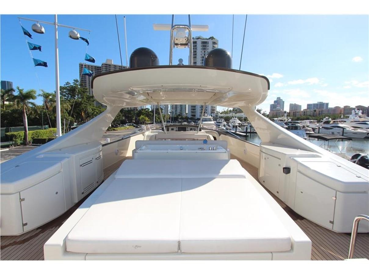 a large white boat in a harbor aboard PRIVILEGIO Yacht for Sale