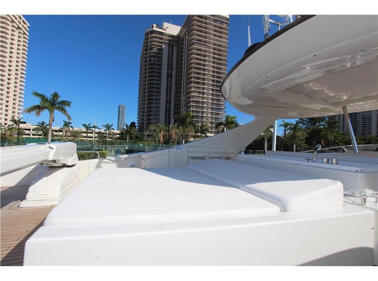 a large white building with a pool aboard PRIVILEGIO Yacht for Sale