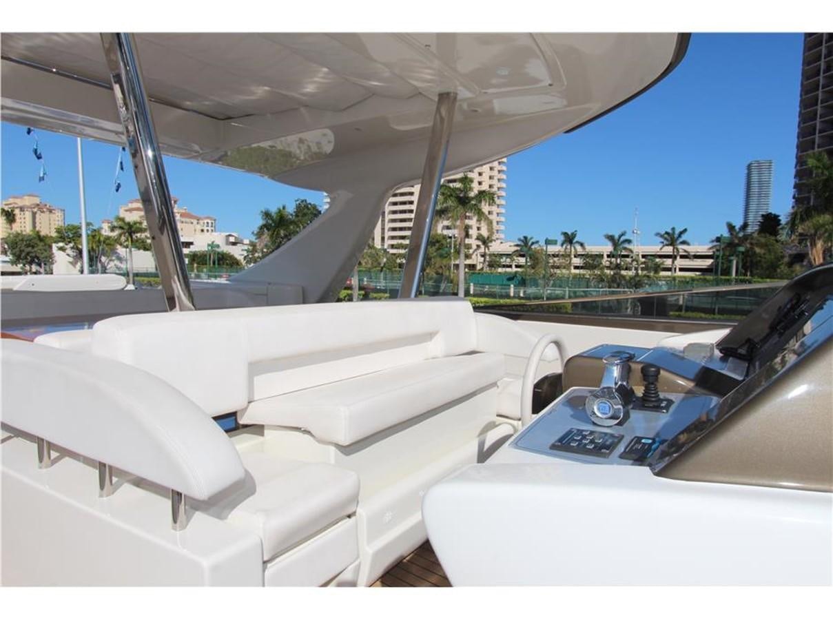 a white car with a white interior aboard PRIVILEGIO Yacht for Sale
