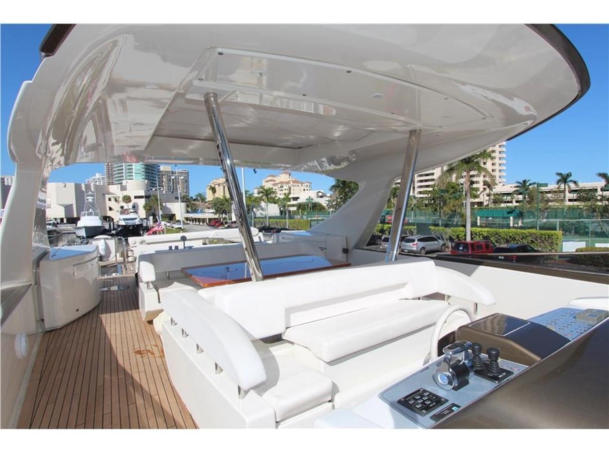 a boat with a deck and a pool aboard PRIVILEGIO Yacht for Sale
