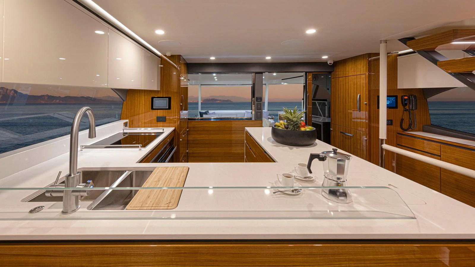 a kitchen with a large island aboard 78 MOTOR YACHT ENCLOSED Yacht for Sale