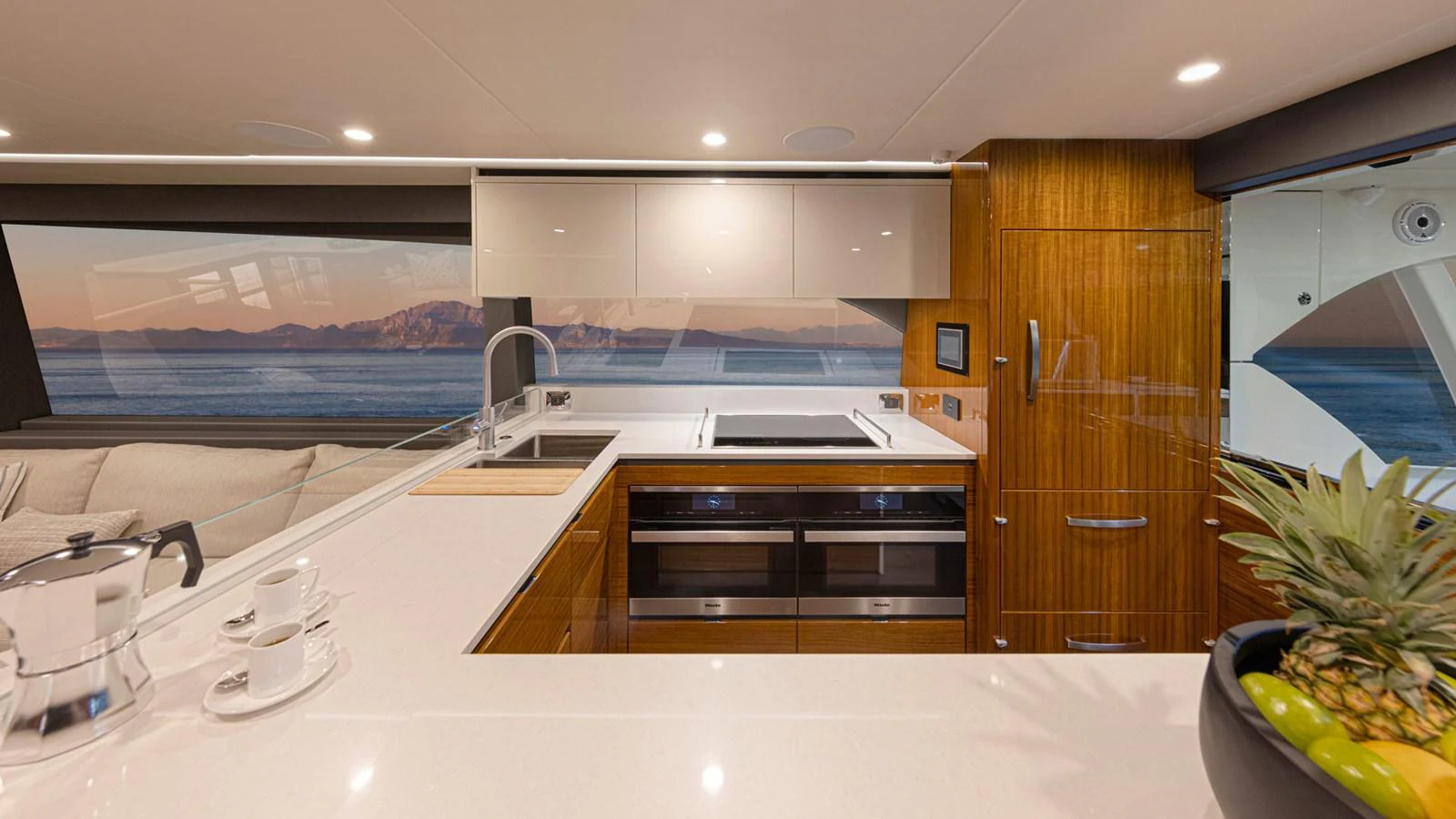 a kitchen with a large window aboard 78 MOTOR YACHT ENCLOSED Yacht for Sale