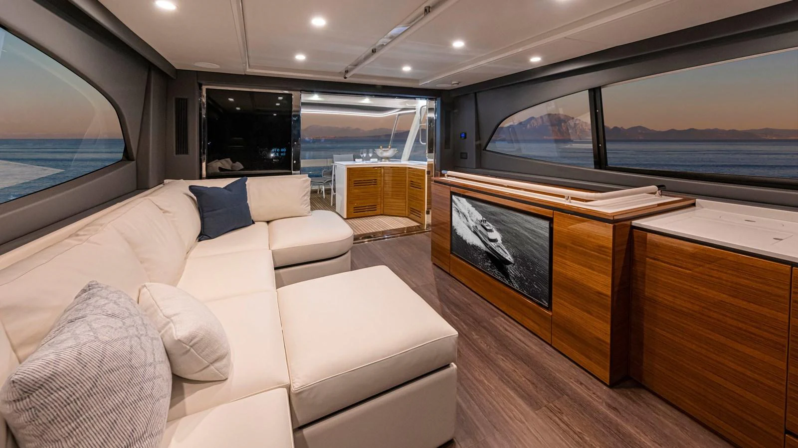 a living room with a large window aboard 78 MOTOR YACHT ENCLOSED Yacht for Sale