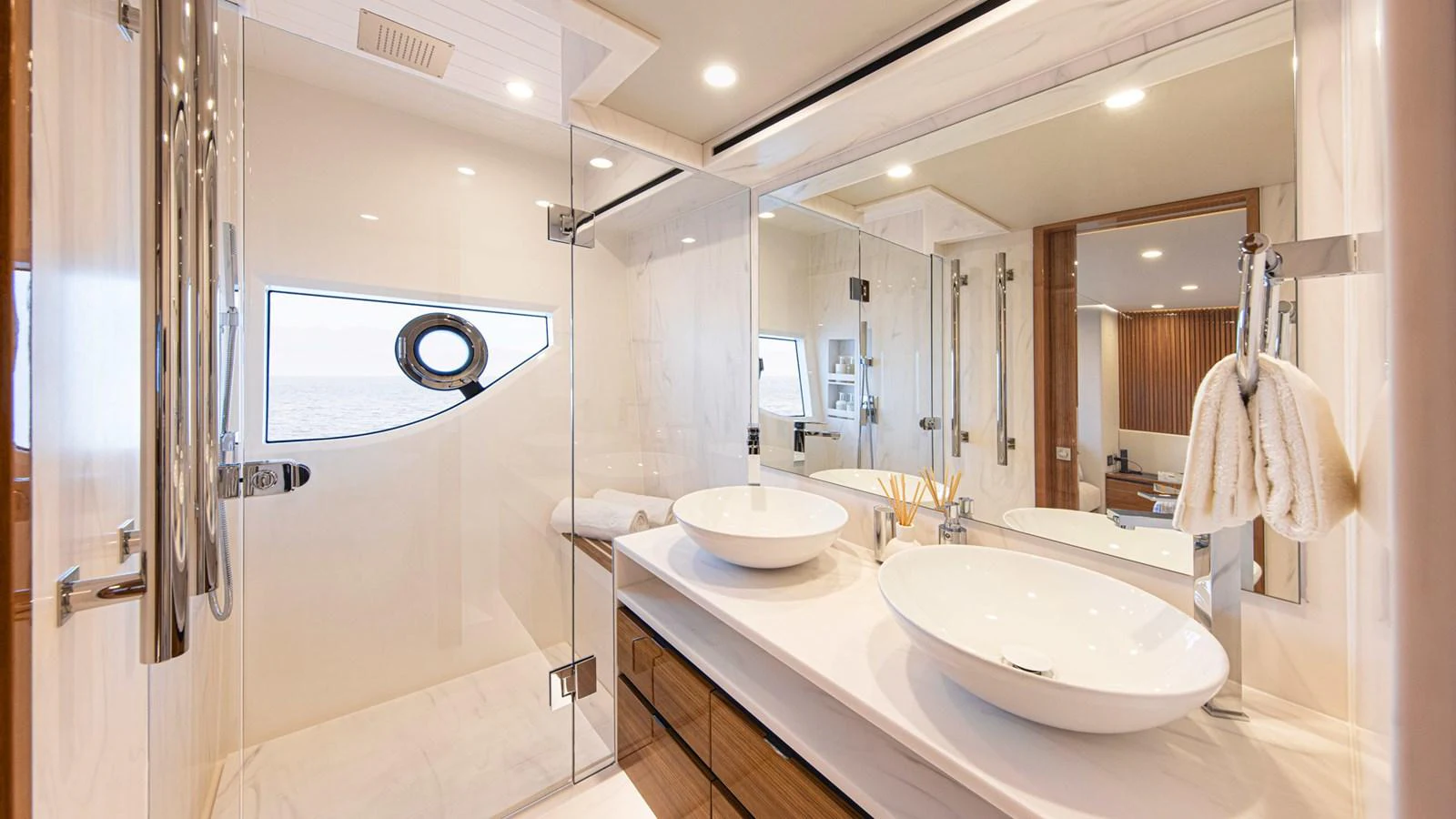 a bathroom with a sink and a mirror aboard 78 MOTOR YACHT ENCLOSED Yacht for Sale