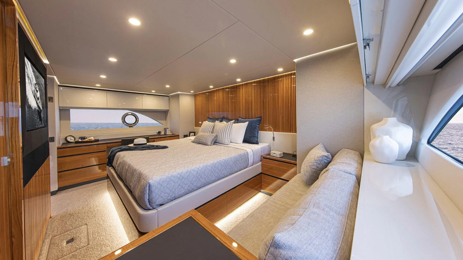 a bedroom with a bed and a television aboard 78 MOTOR YACHT ENCLOSED Yacht for Sale