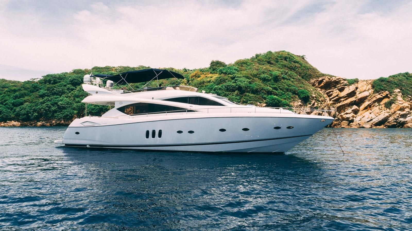 a white yacht on the water aboard LUCKY BEAR Yacht for Sale