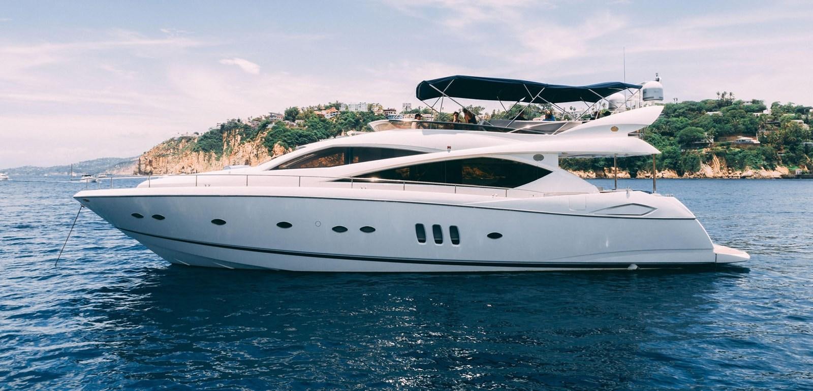 a white yacht in the water aboard LUCKY BEAR Yacht for Sale