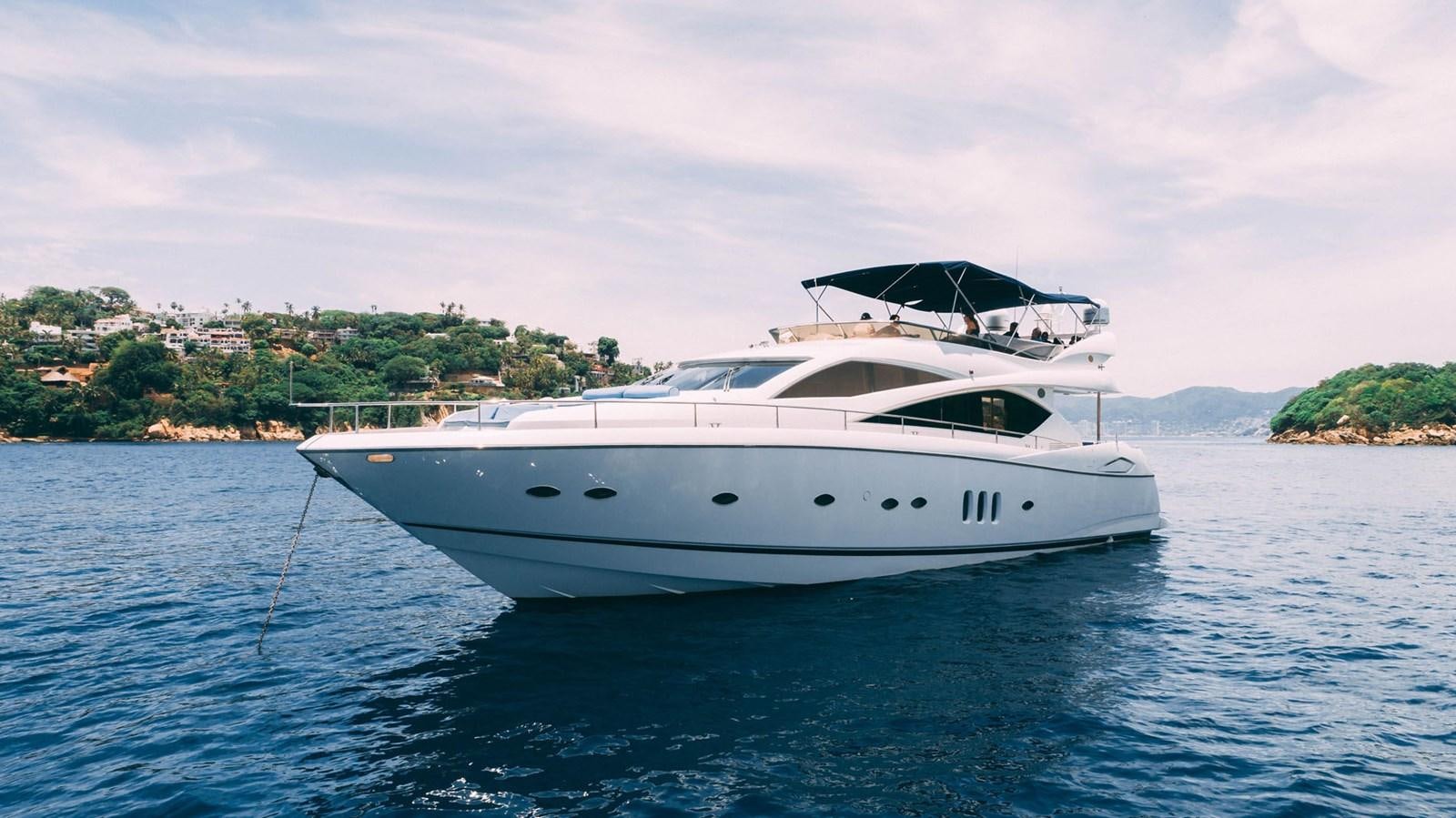 a white yacht in the water aboard LUCKY BEAR Yacht for Sale