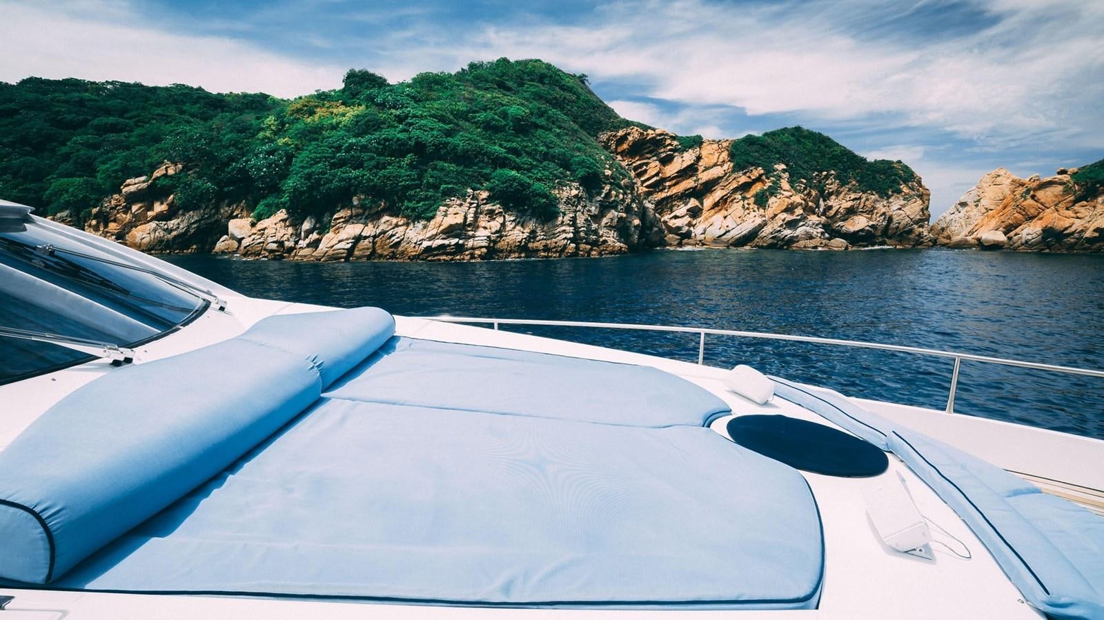 a boat on the water aboard LUCKY BEAR Yacht for Sale