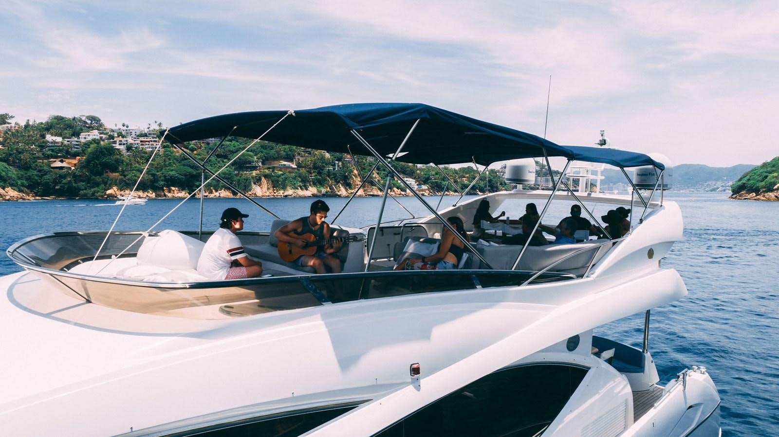 a group of people in a boat aboard LUCKY BEAR Yacht for Sale