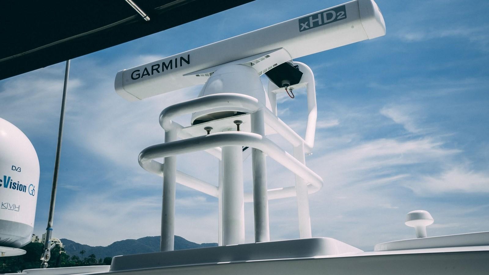 a white wind turbine aboard LUCKY BEAR Yacht for Sale