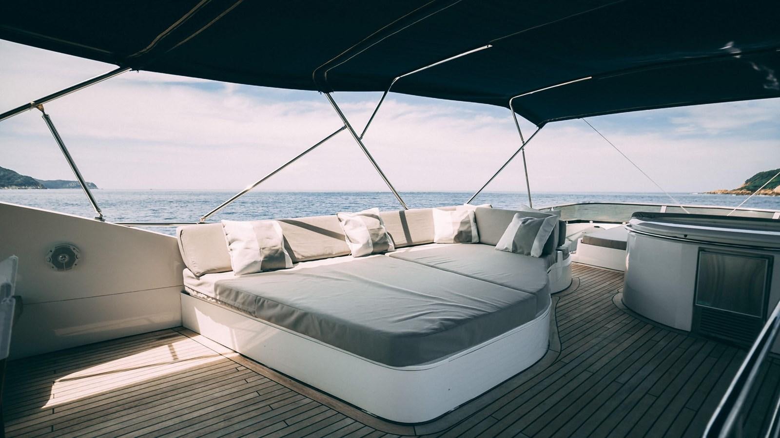a bed on a deck aboard LUCKY BEAR Yacht for Sale