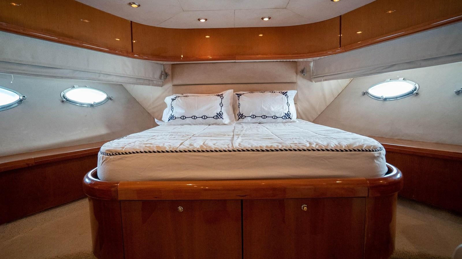 a bed in a room aboard LUCKY BEAR Yacht for Sale