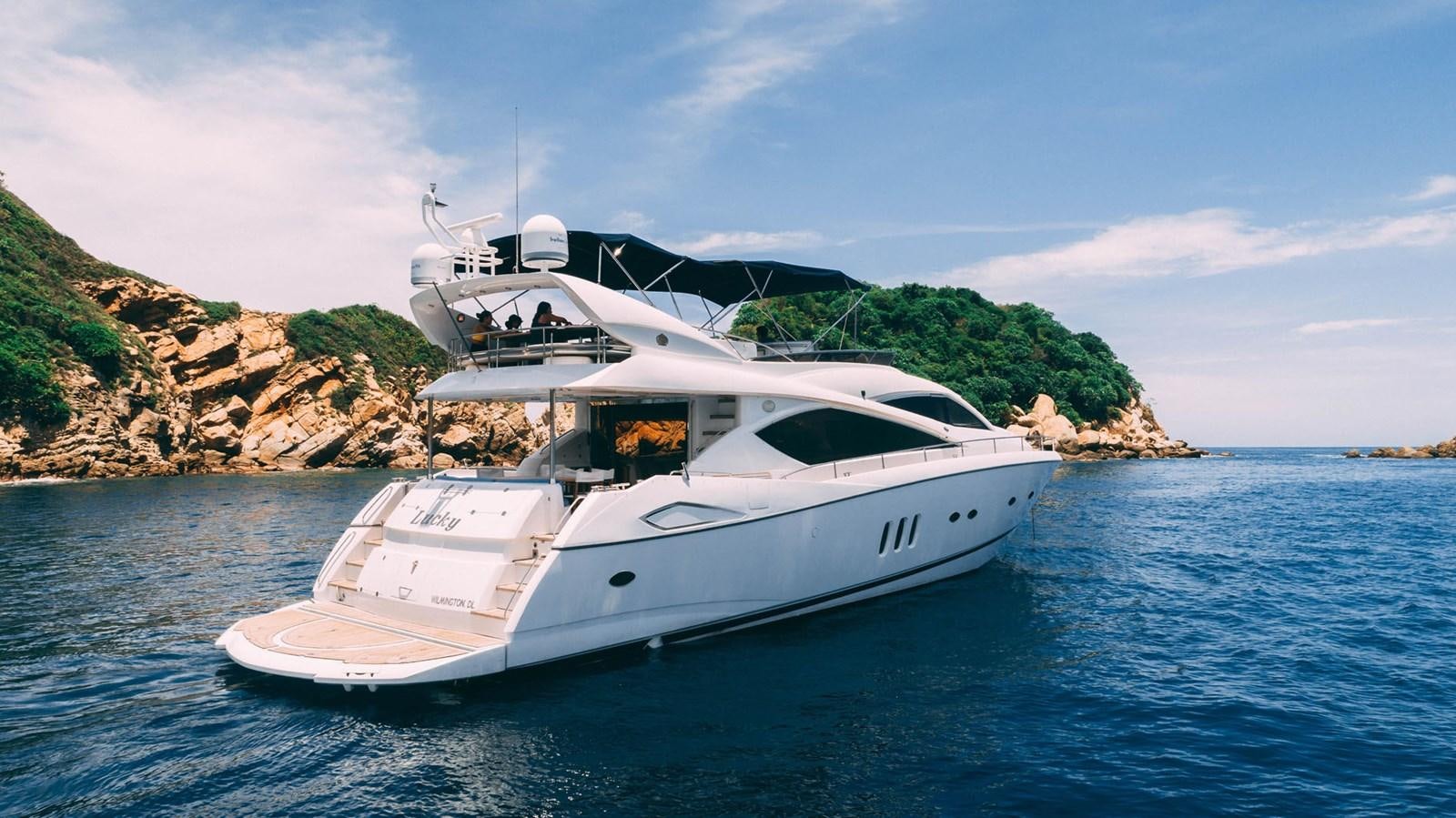 a white yacht on the water aboard LUCKY BEAR Yacht for Sale