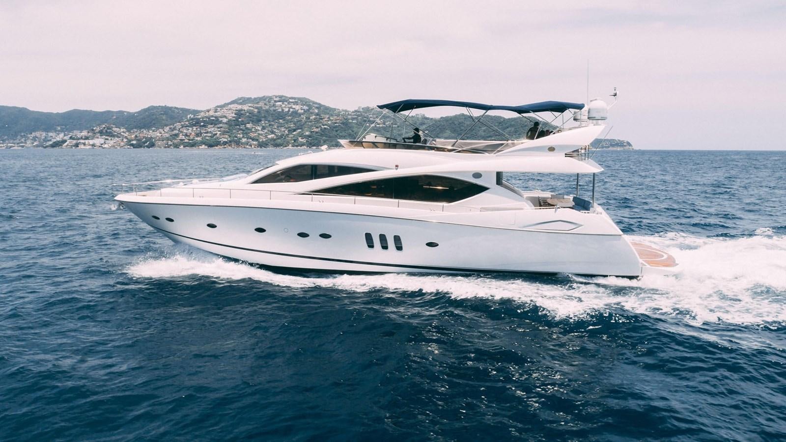 a white yacht on the water aboard LUCKY BEAR Yacht for Sale