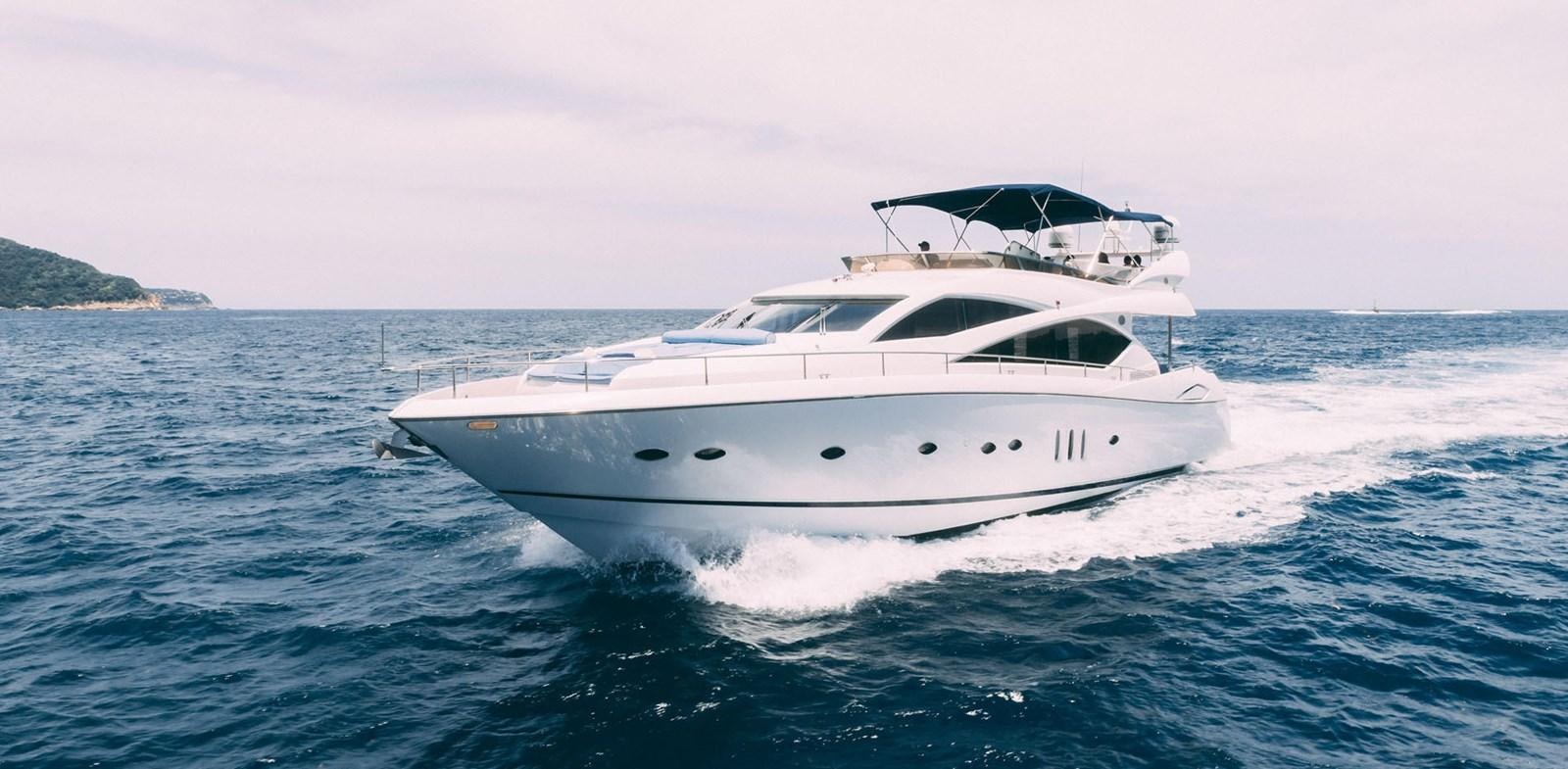 a white yacht on the water aboard LUCKY BEAR Yacht for Sale