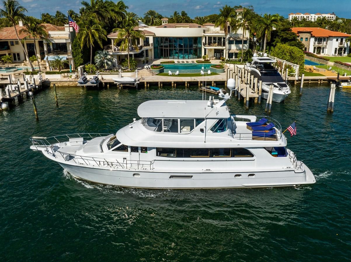 a boat docked at a pier aboard DIAMOND LADY Yacht for Sale