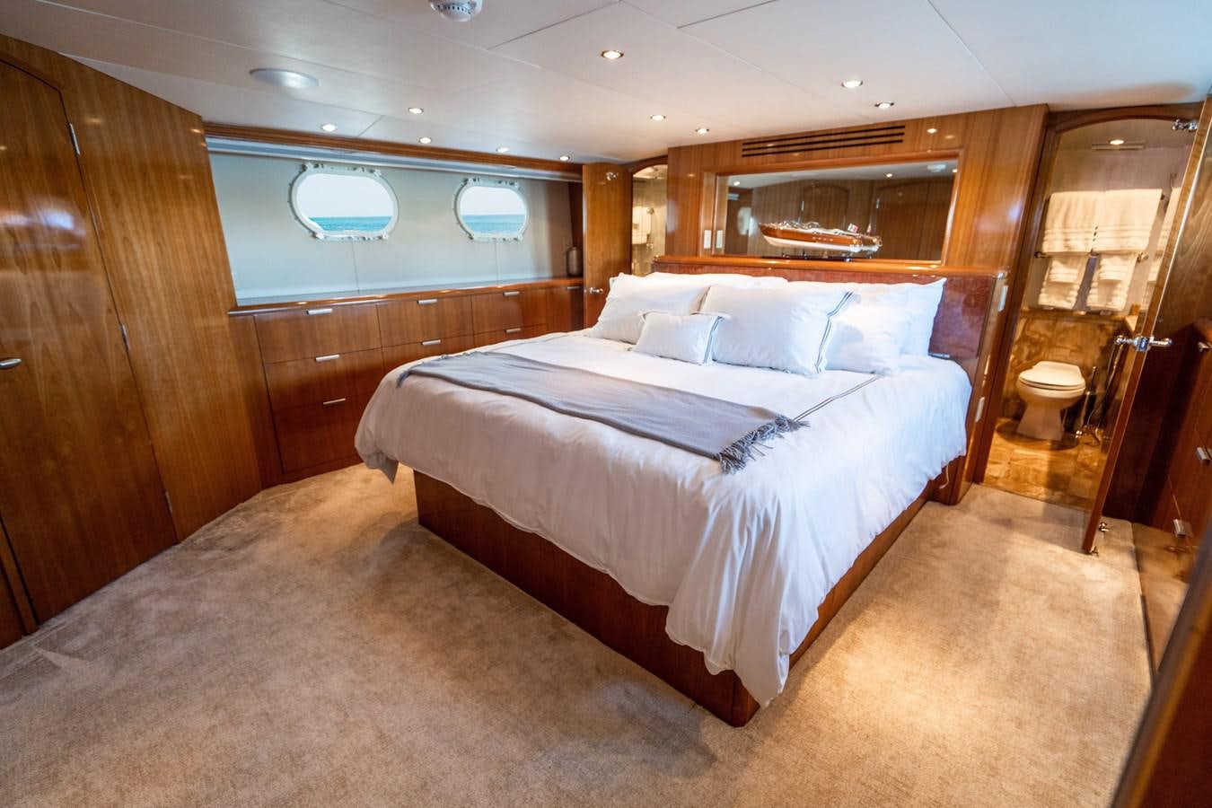 a large bedroom with a large bed aboard DIAMOND LADY Yacht for Sale